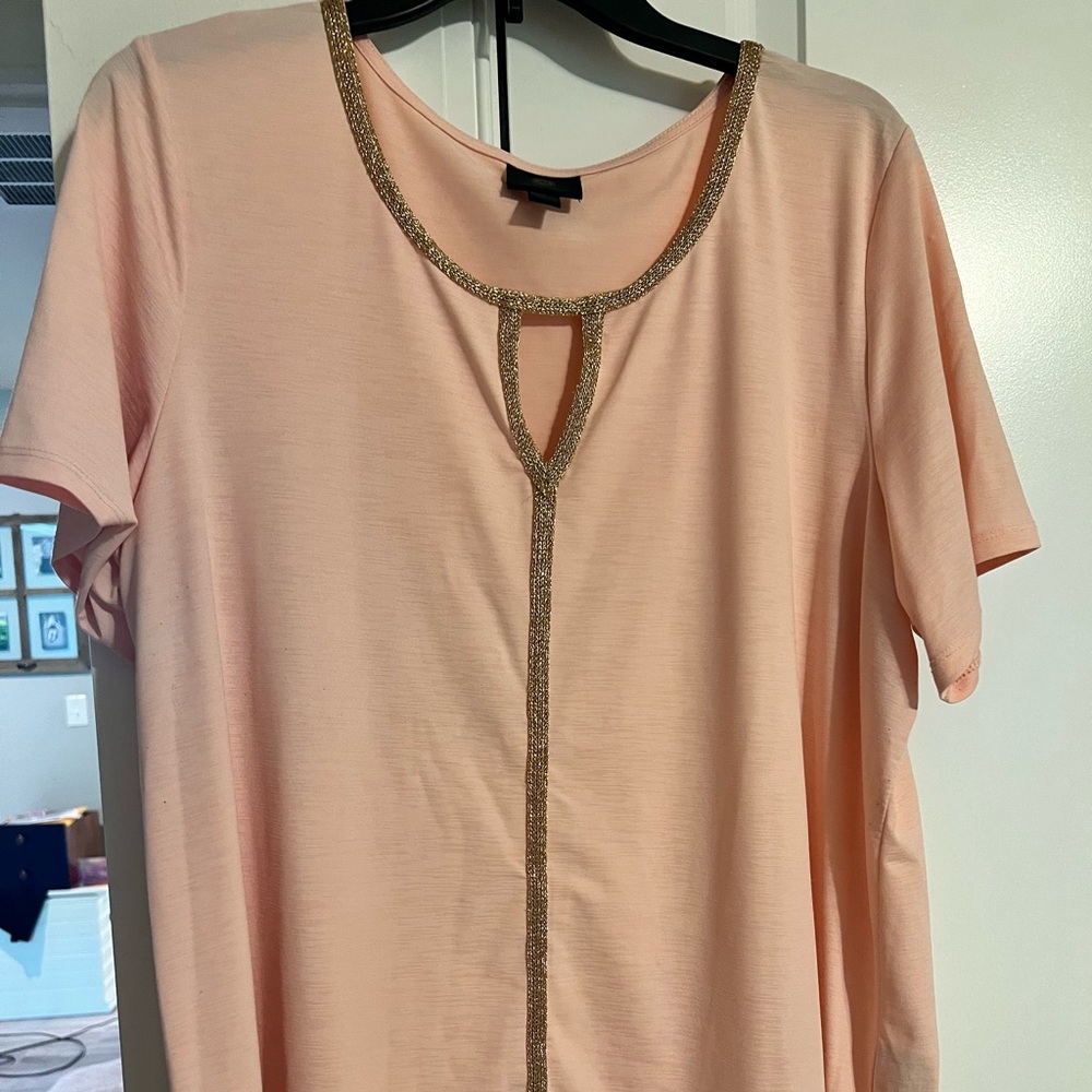 Never worn peach shirt with gold outlining. Very nice material